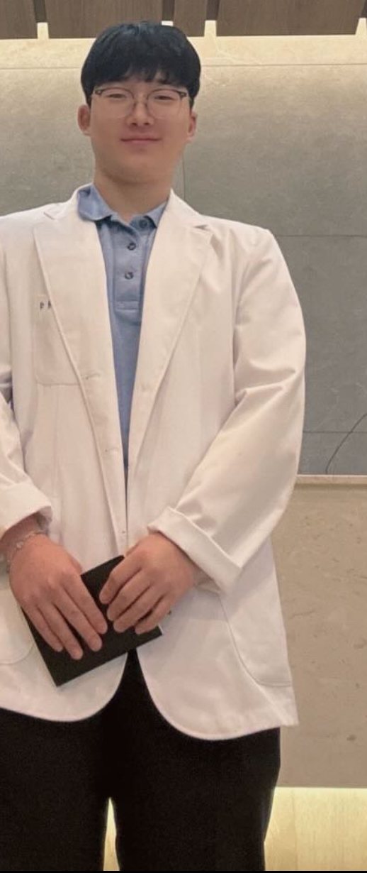 Yumin in a white coat at Yonsei Baro Dental Clinic